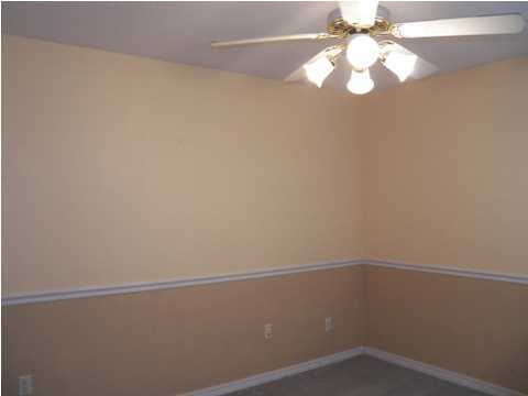 725 Riva Ridge Drive Crestview, FL 32539 - Photo 14 of 22 a view of a small space with racks on the wall