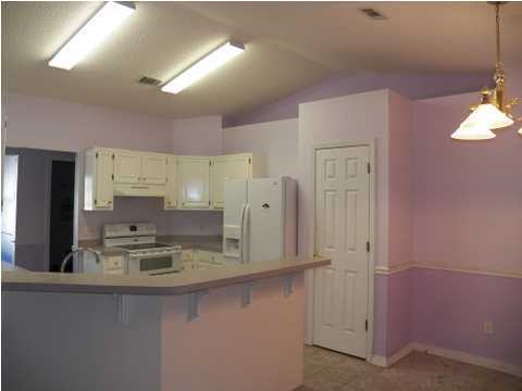 725 Riva Ridge Drive Crestview, FL 32539 - Photo 3 of 22 a bathroom with double vanity sink and mirror