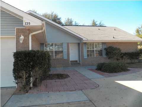 725 Riva Ridge Drive Crestview, FL 32539 - Photo 22 of 22 a front view of a house with garden