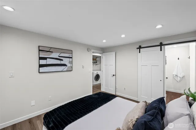 a bedroom with a bed and a walk in closet