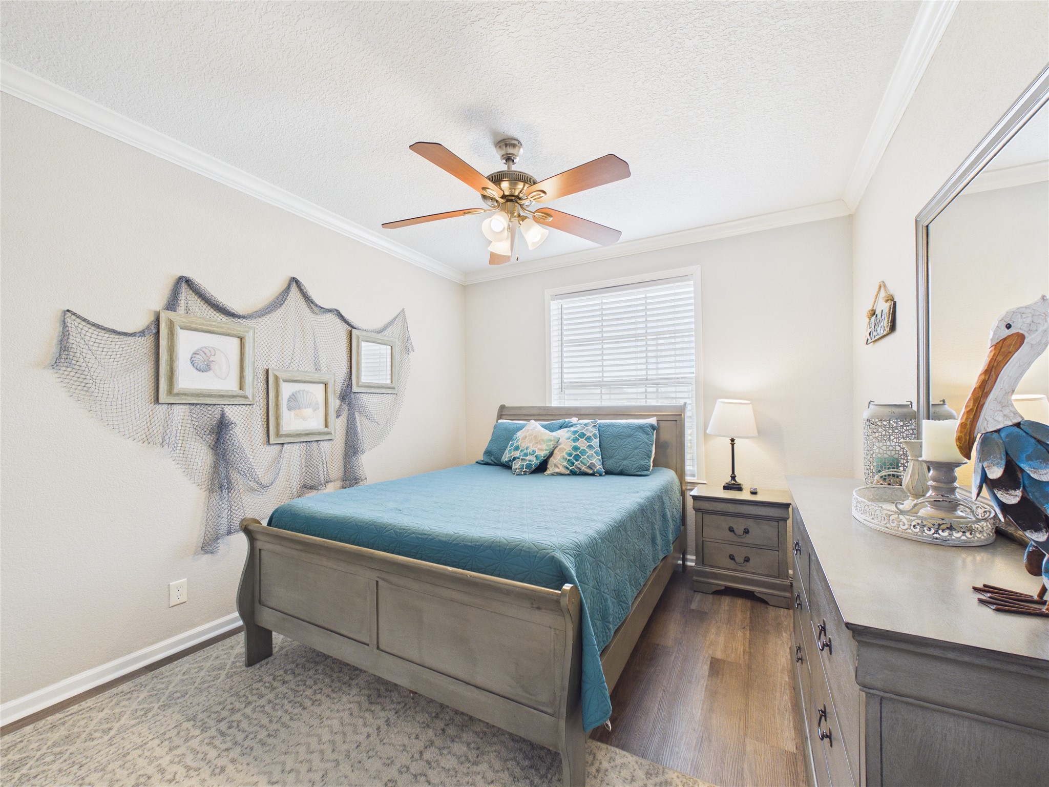 905 Meynig Drive Crystal Beach, TX 77650 - Photo 30 of 50 Bedroom two offers a warm, inviting space designed to make guests feel right at home