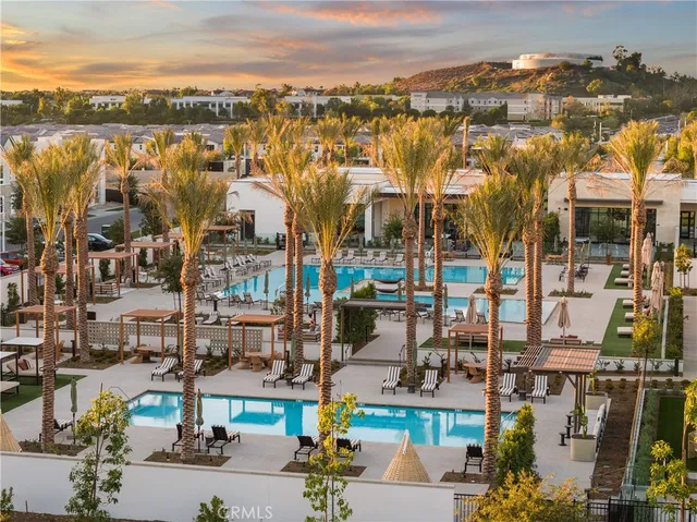 a living room with furniture and large windows