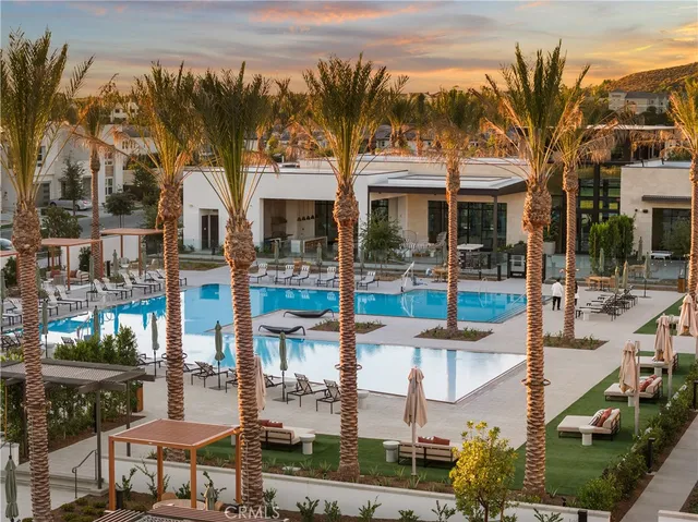 a living room with furniture and large window