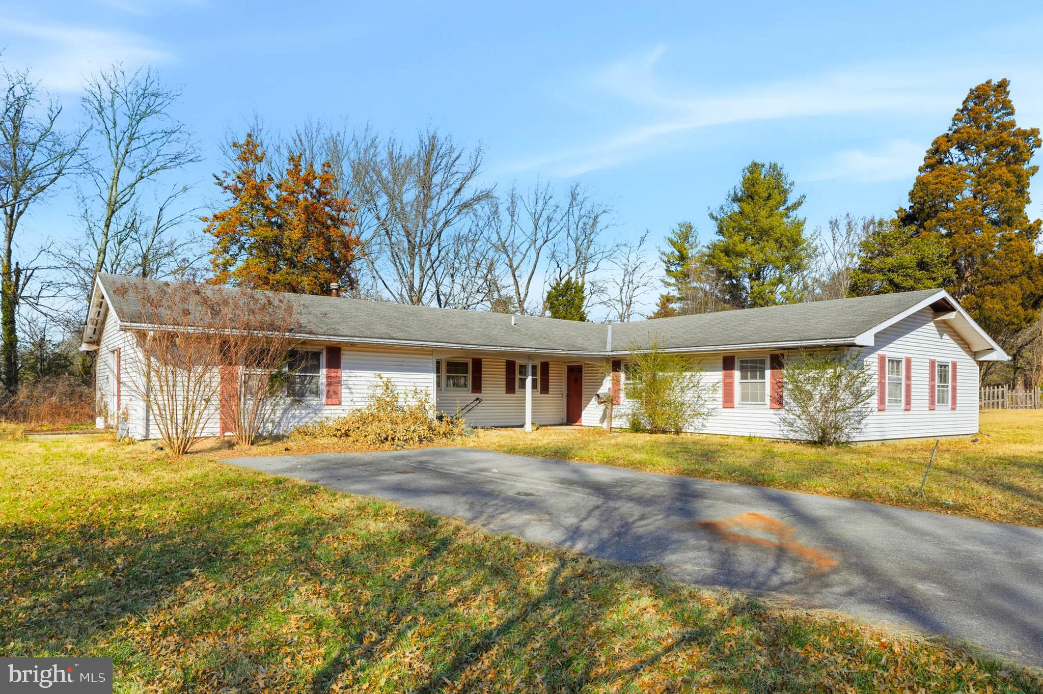 9200 Pleasant Court Laurel, MD 20708 - Photo 3 of 10 a front view of a house with a yard and trees
