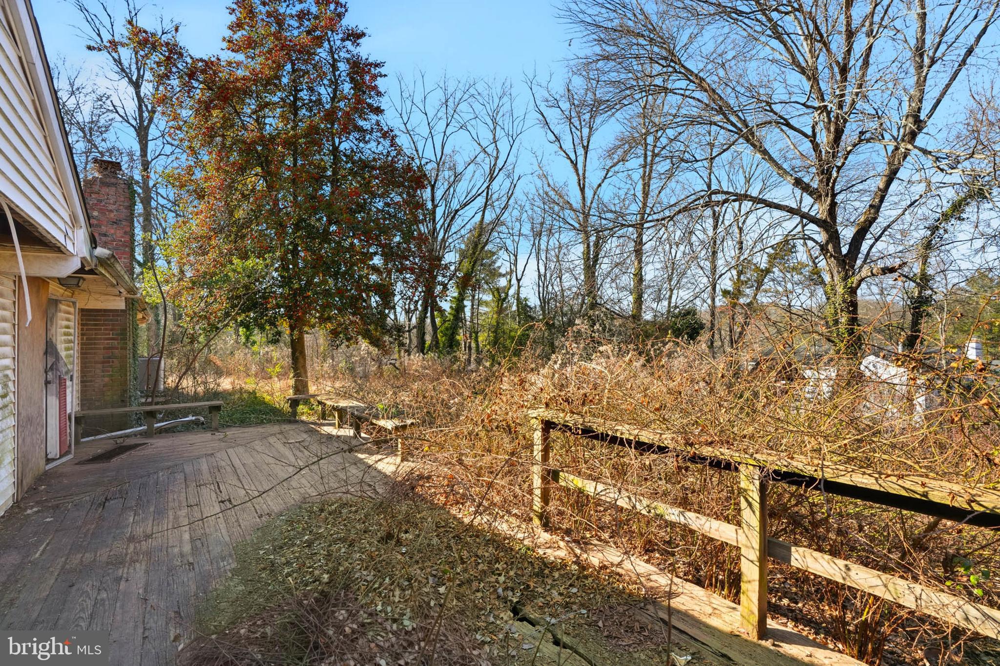 9200 Pleasant Court Laurel, MD 20708 - Photo 6 of 10 a view of a yard with wooden fence