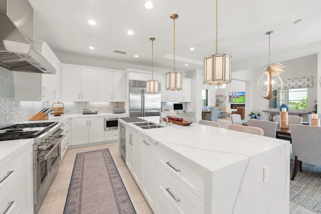 a front view of a house with a yard and a garage