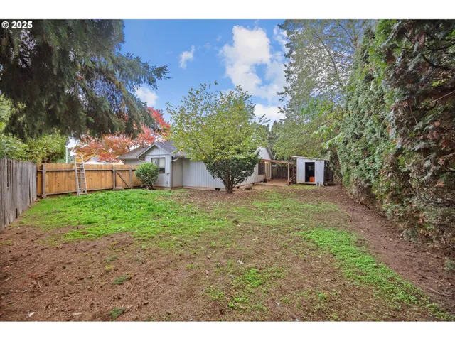 a backyard of a house with lots of green space