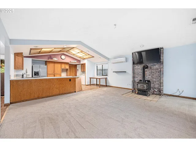 a view of an empty room with a cabinet