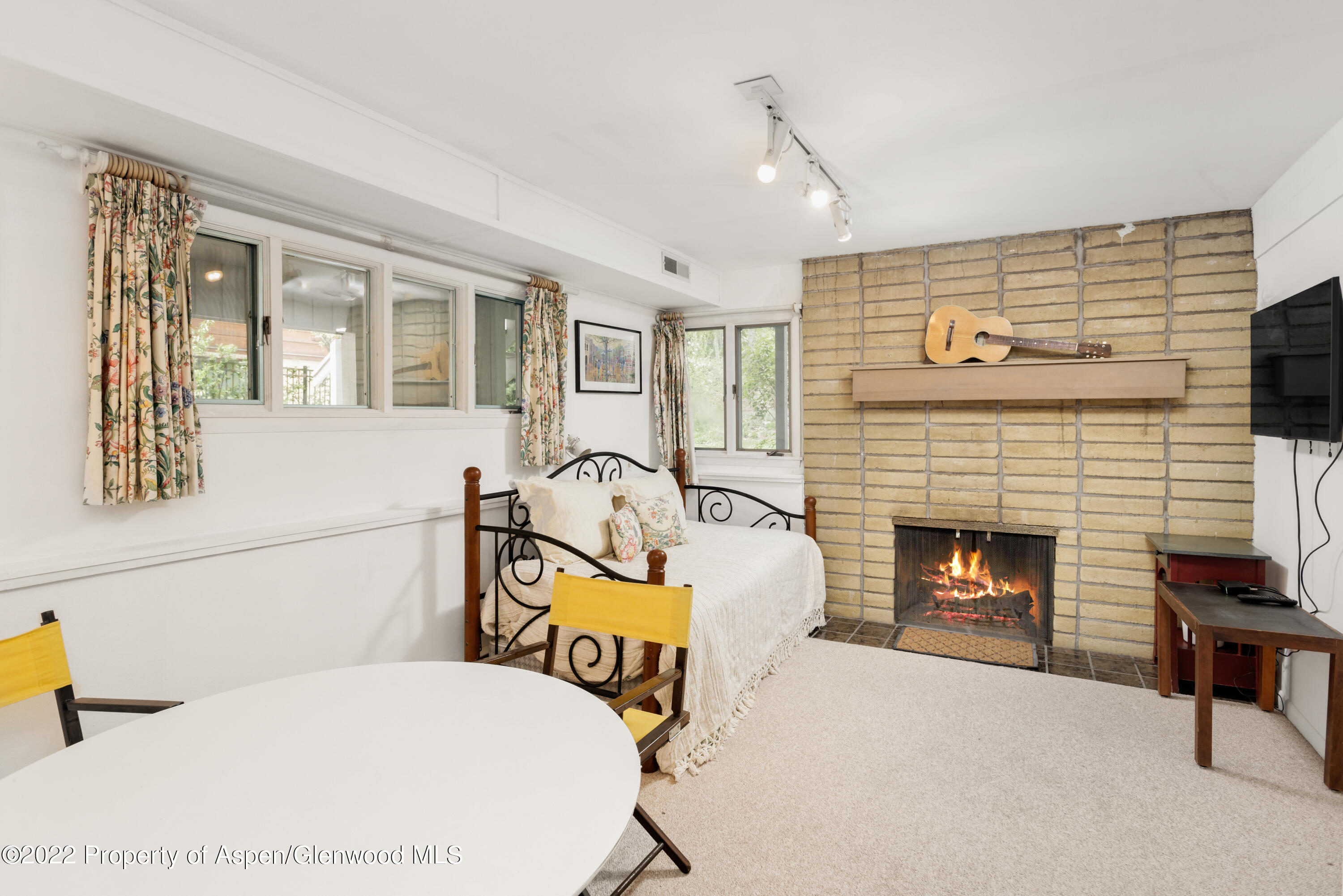 521 North 7th Street, Unit B Aspen, CO 81611 - Photo 16 of 26 a living room with furniture and a fireplace