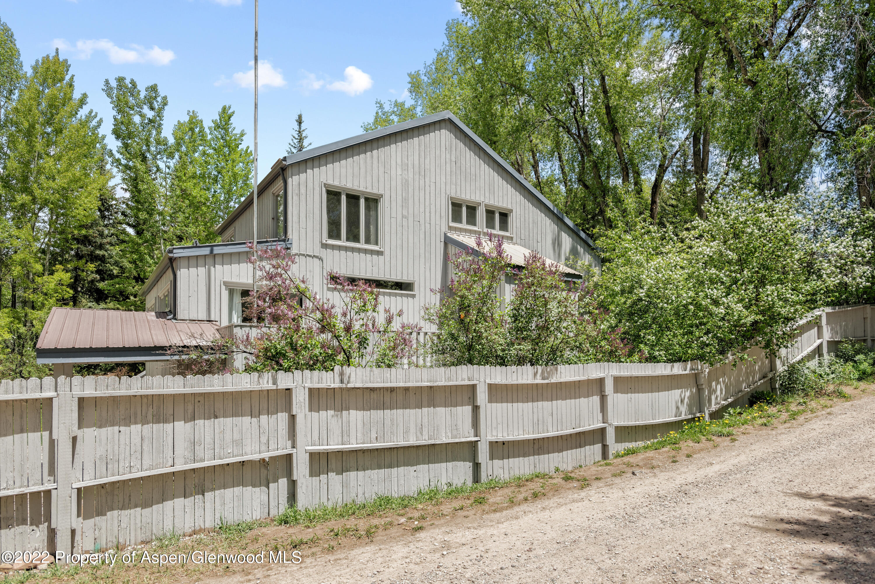 521 North 7th Street, Unit B Aspen, CO 81611 - Photo 22 of 26 a front view of a house with a yard