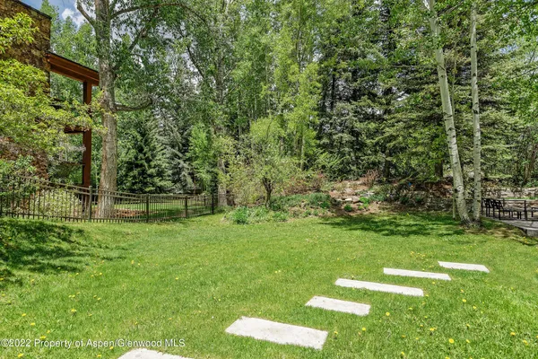 a backyard of a house with lots of green space