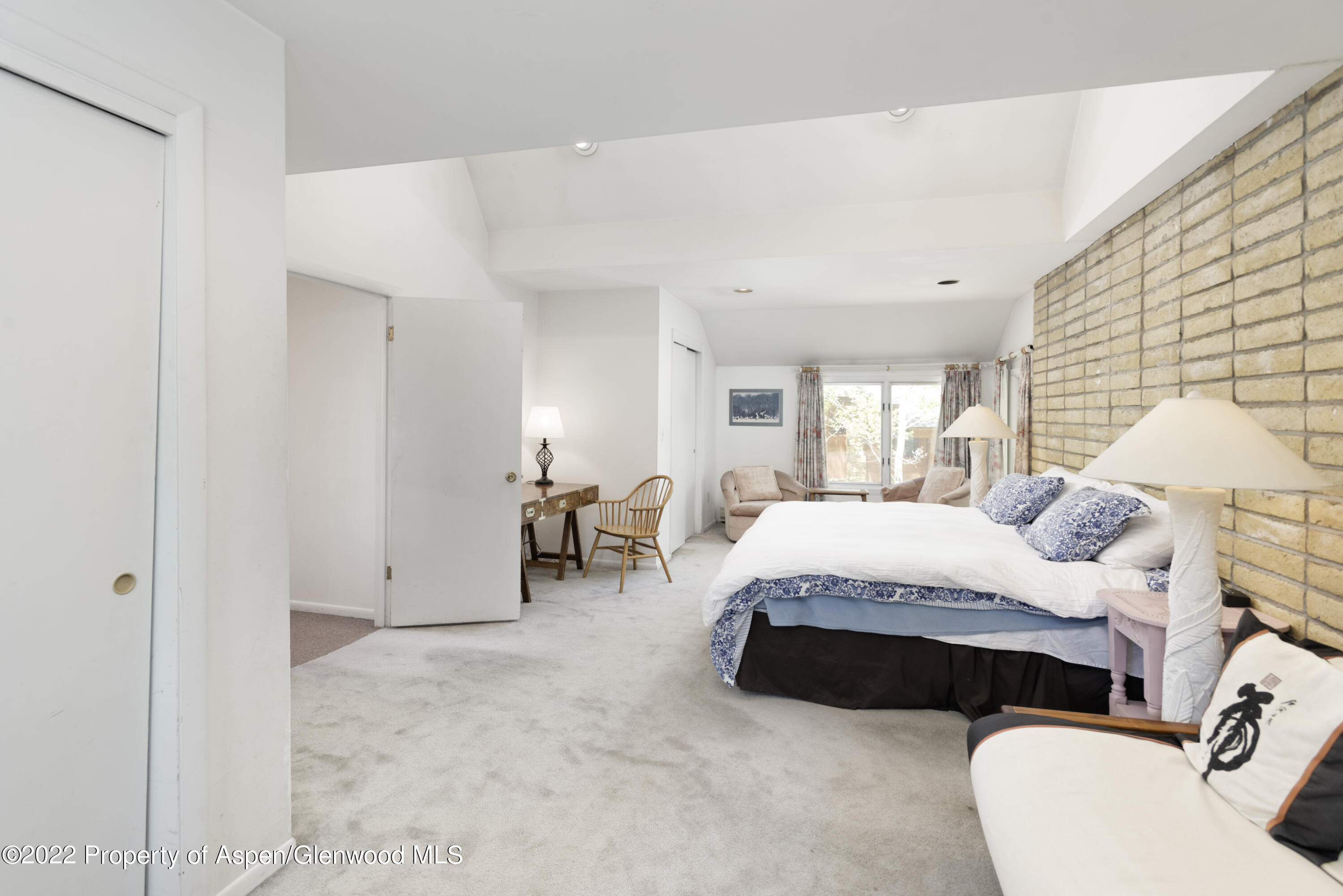 521 North 7th Street, Unit B Aspen, CO 81611 - Photo 7 of 26 a spacious bedroom with a bed and window