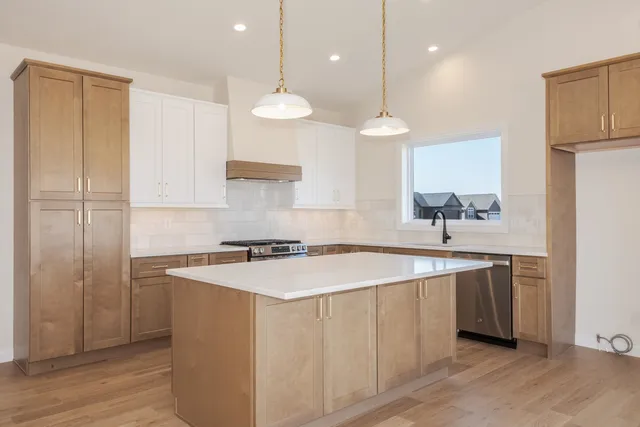 a kitchen with a sink and cabinets