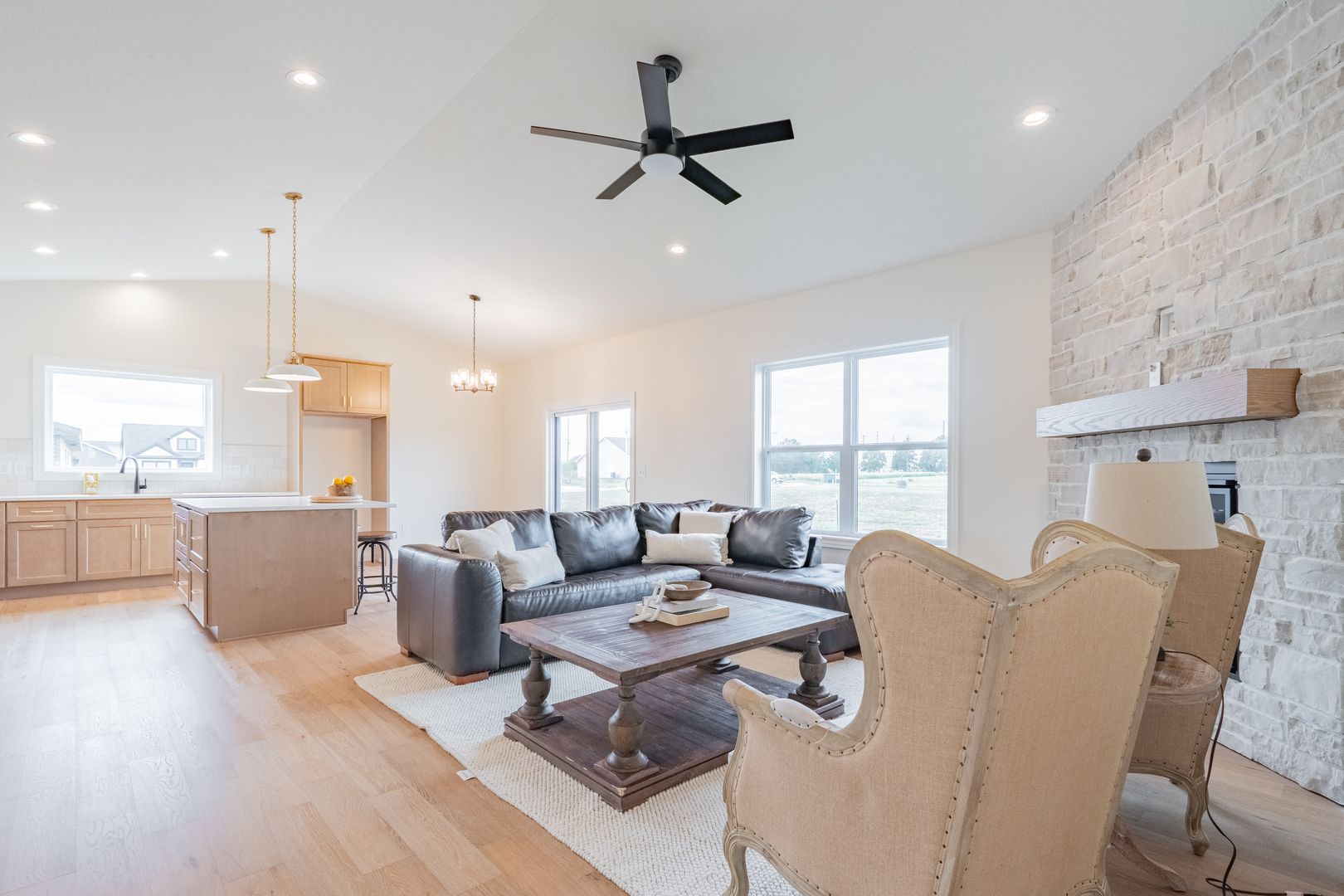 2538 Marble Road Normal, IL 61761 - Photo 2 of 52 a living room with furniture ceiling fan and a large window