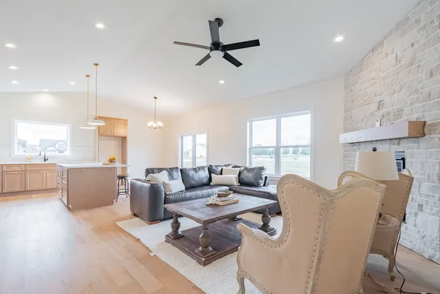 a view of a livingroom with a window and wooden floor