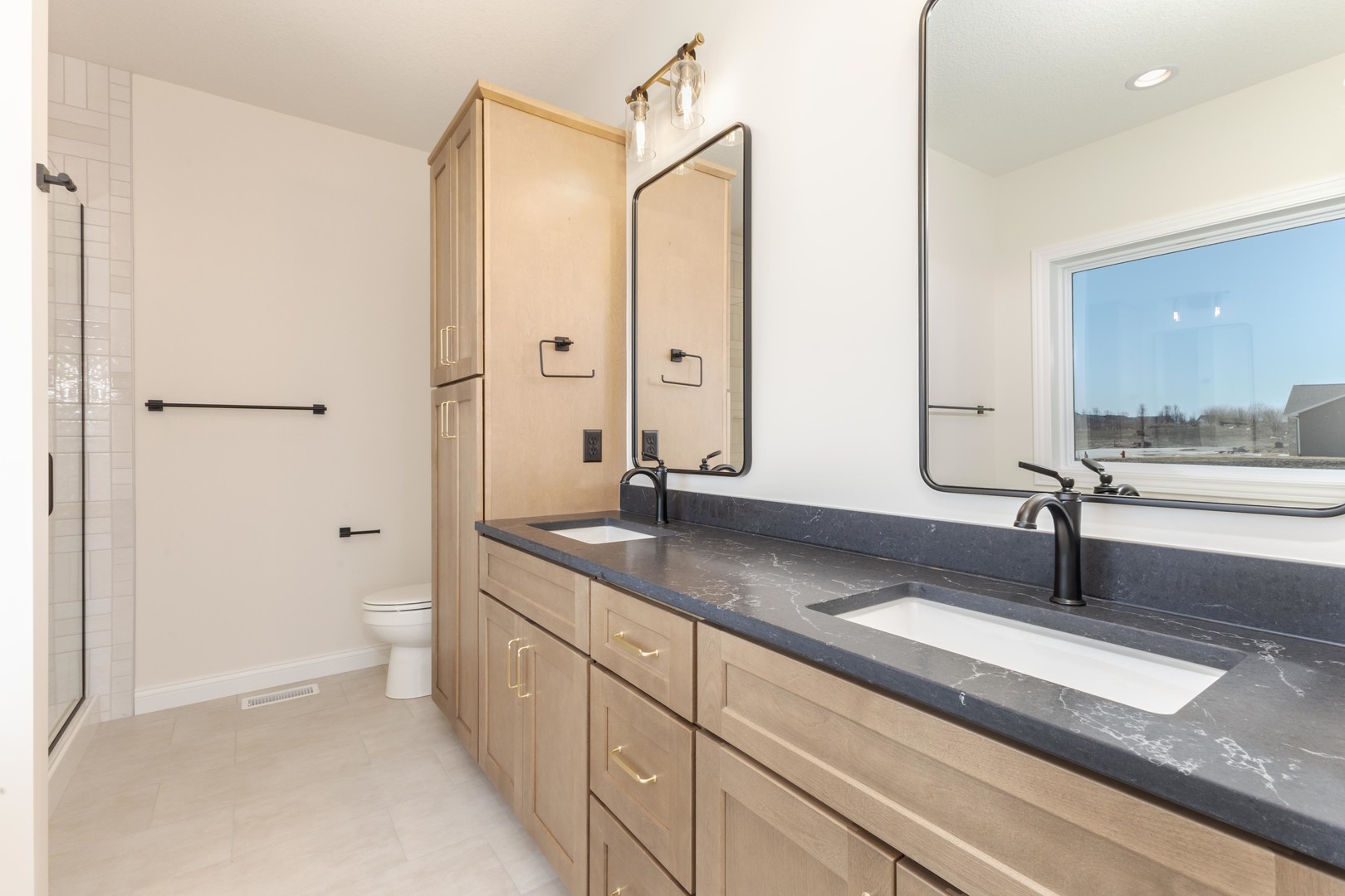 2538 Marble Road Normal, IL 61761 - Photo 26 of 52 a bathroom with a double vanity sink and mirror with shower