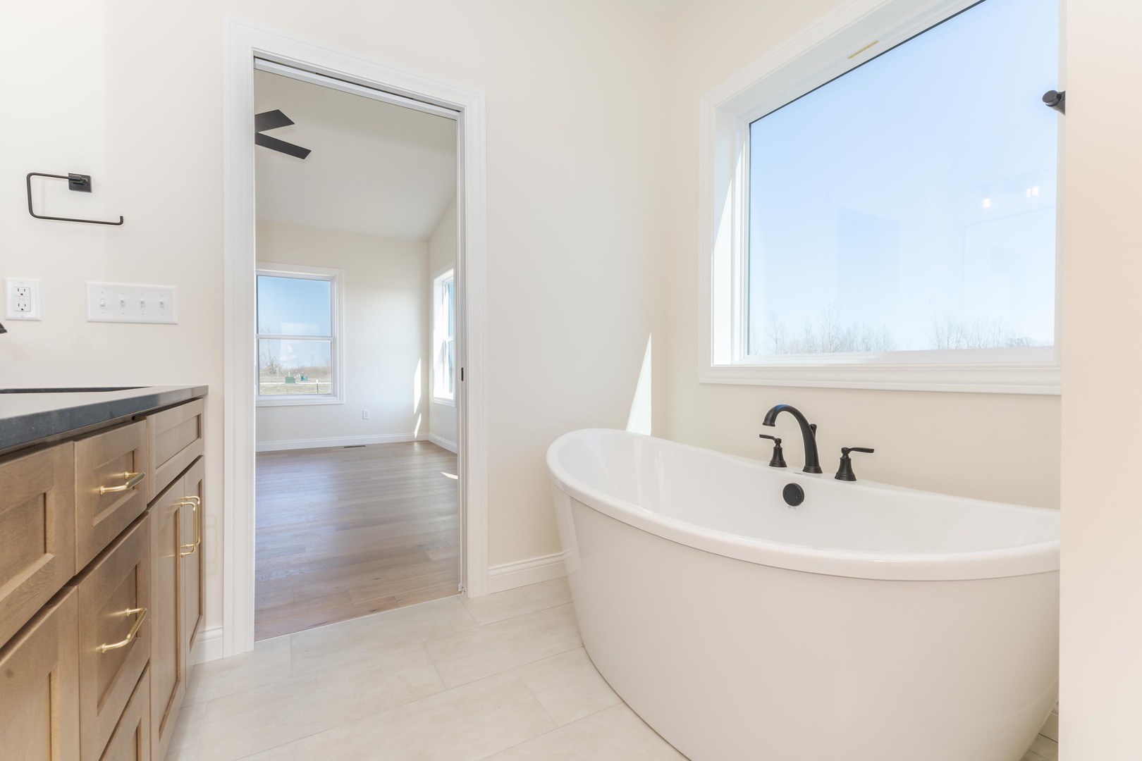 2538 Marble Road Normal, IL 61761 - Photo 29 of 52 a bathroom with a sink a mirror and a bathtub