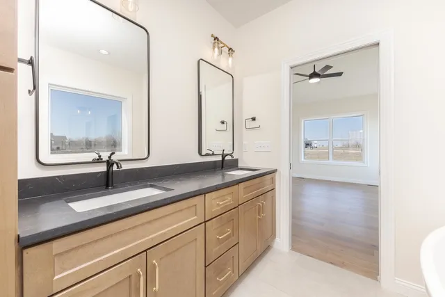 a bathroom with a sink a mirror and a bathtub