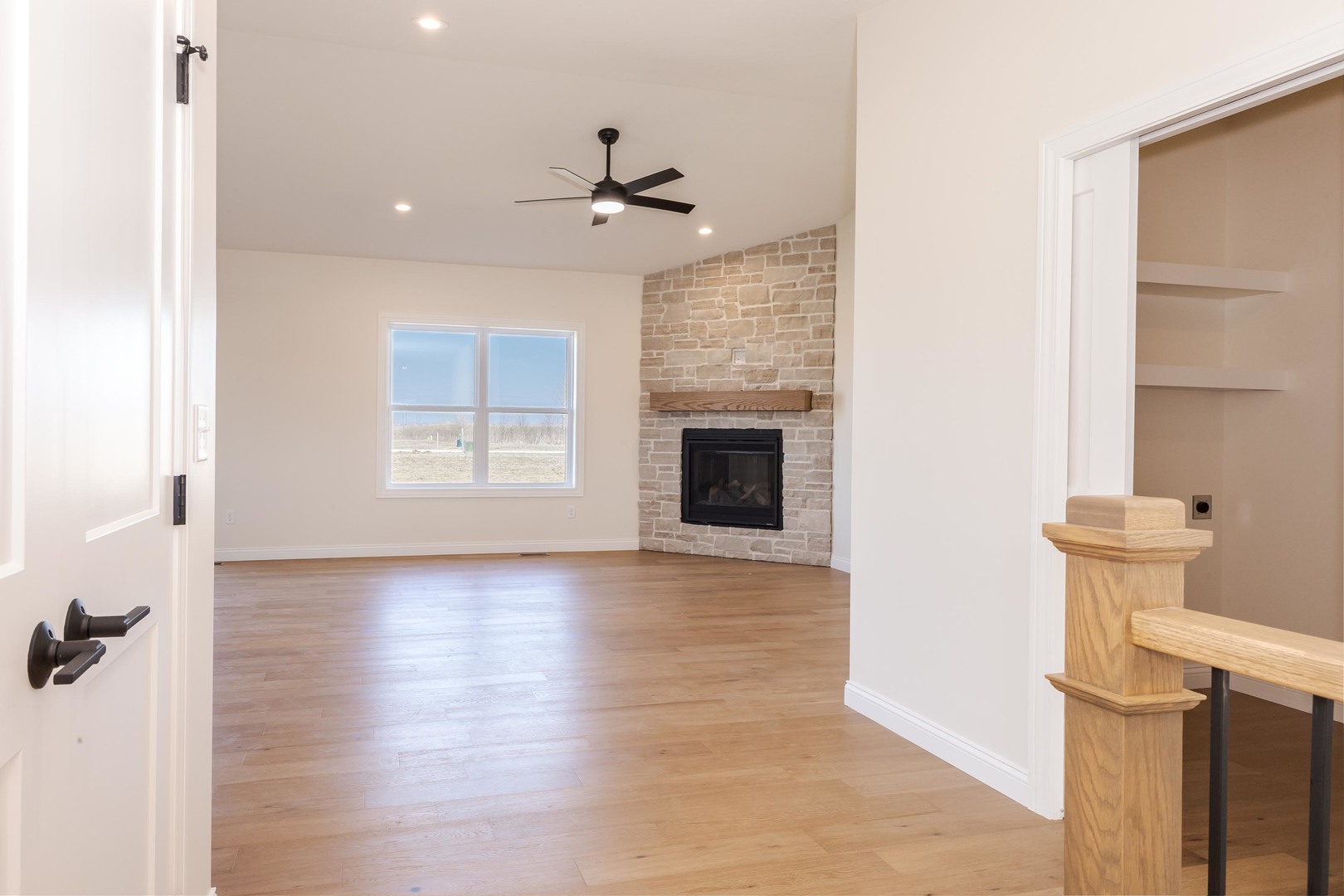 2538 Marble Road Normal, IL 61761 - Photo 3 of 52 a view of empty room with wooden floor and fan