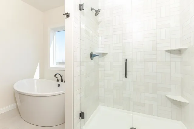 a view of a kitchen with a sink and a large window