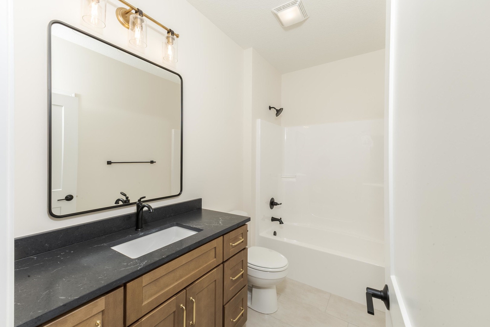 2538 Marble Road Normal, IL 61761 - Photo 36 of 52 a bathroom with a granite countertop sink toilet and mirror