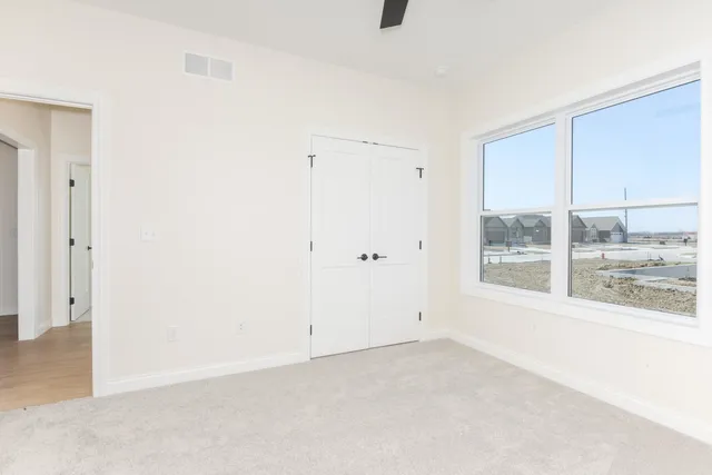 a view of a room with wooden walls
