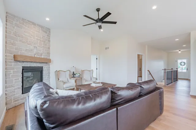 a living room with furniture and a fireplace