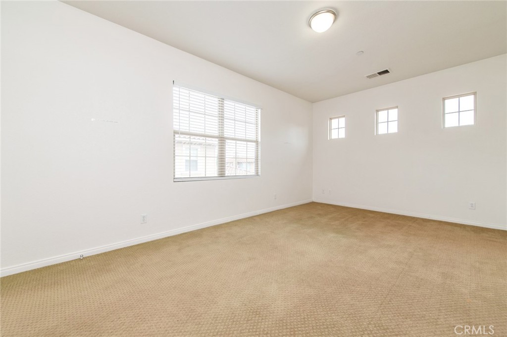 77 Hallmark Irvine, CA 92620 - Photo 12 of 35 an empty room with windows