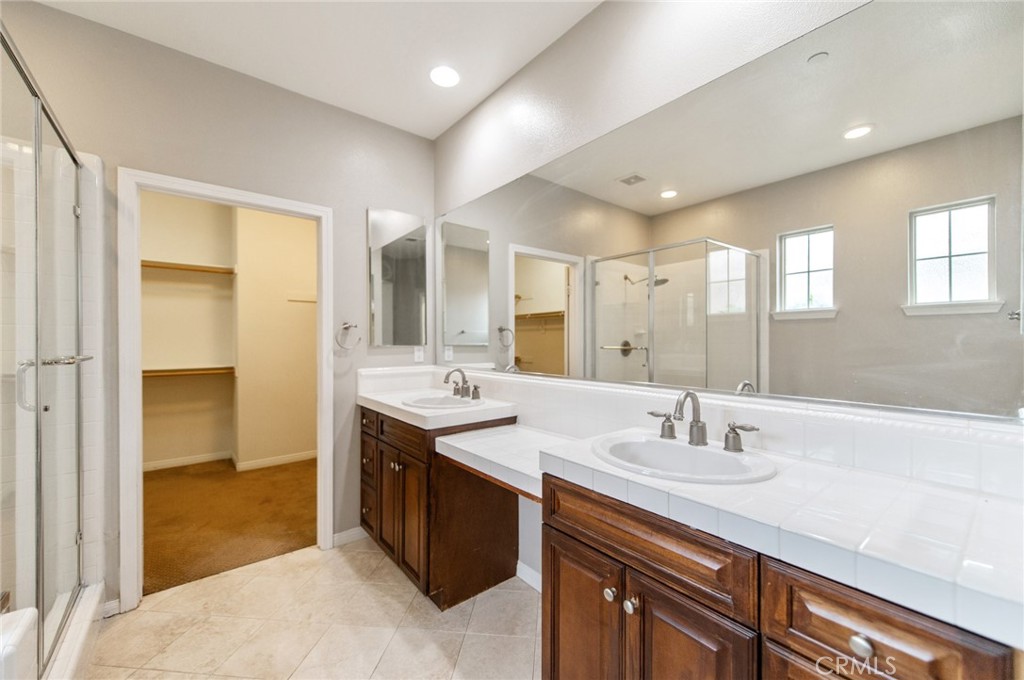 77 Hallmark Irvine, CA 92620 - Photo 15 of 35 a bathroom with a double vanity sink mirror and