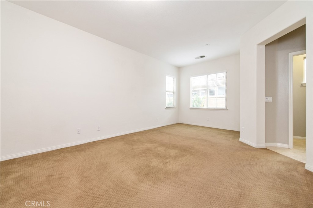 77 Hallmark Irvine, CA 92620 - Photo 19 of 35 an empty room with windows