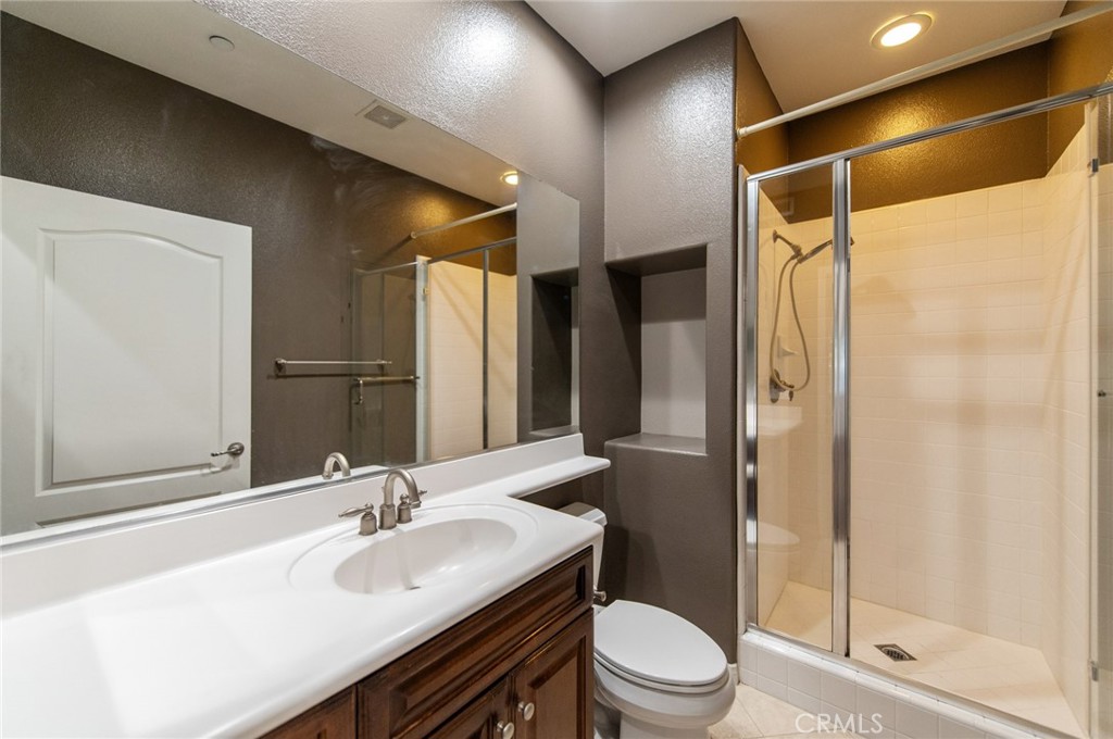 77 Hallmark Irvine, CA 92620 - Photo 26 of 35 a bathroom with a sink toilet and shower