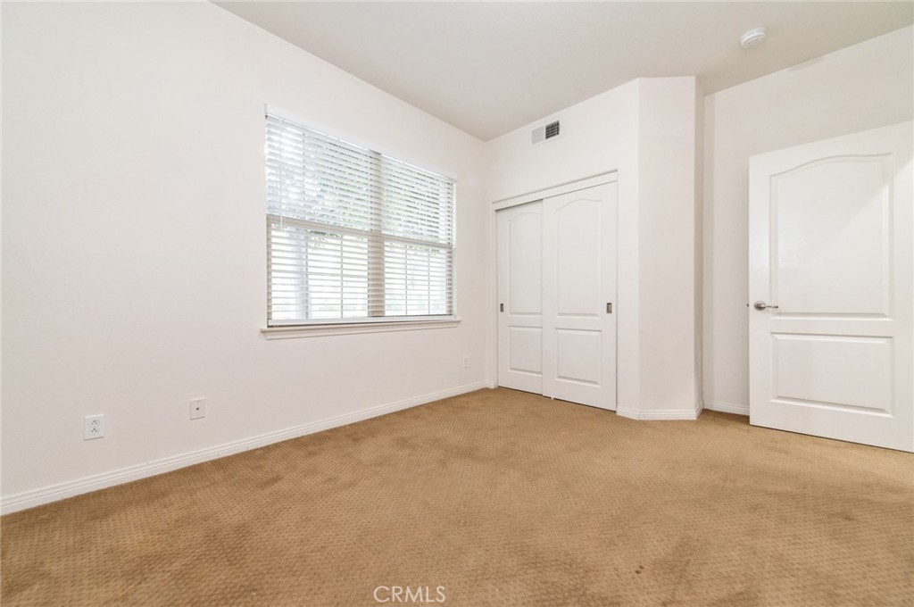 77 Hallmark Irvine, CA 92620 - Photo 27 of 35 an empty room with windows