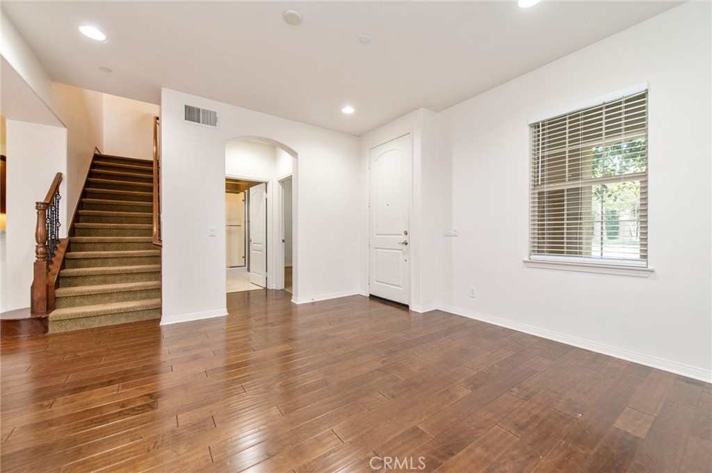 77 Hallmark Irvine, CA 92620 - Photo 29 of 35 a view of an empty room with wooden floor and entryway