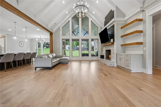 a living room with furniture flat screen tv and a fireplace