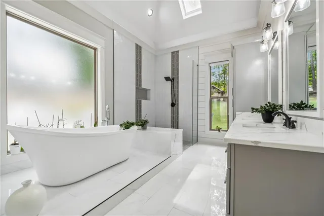 a bathroom with a granite countertop sink a toilet and a mirror