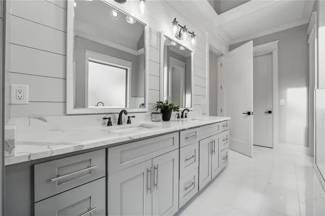 a front view of a house with a garden and porch