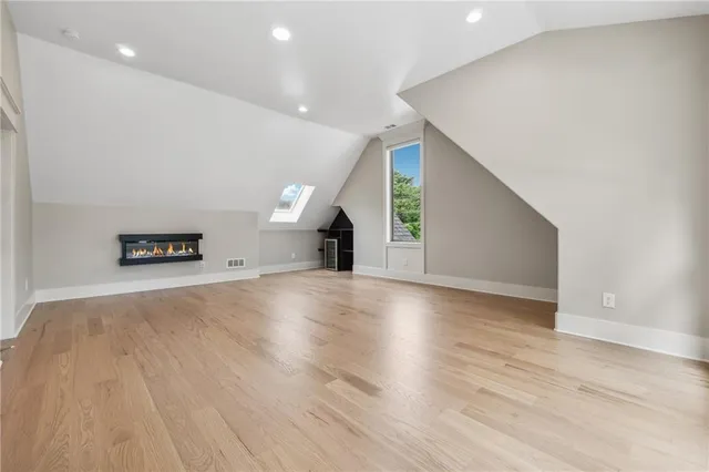 an aerial view of a house with a yard and lake view