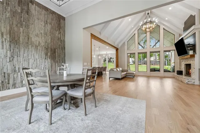 a view of a livingroom with furniture and a floor to ceiling window