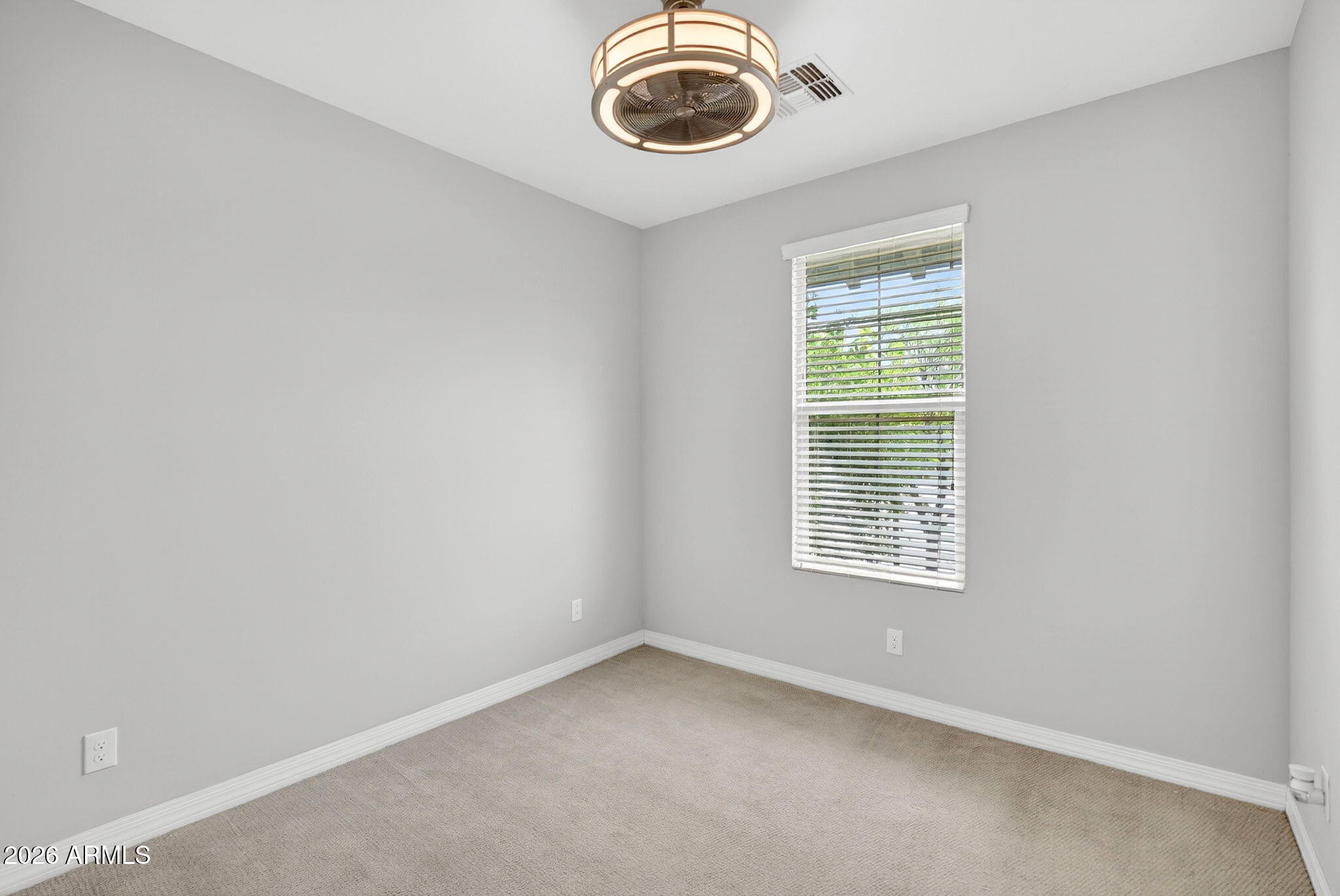 12124 West Peak View Road Peoria, AZ 85383 - Photo 24 of 38 an empty room with a window