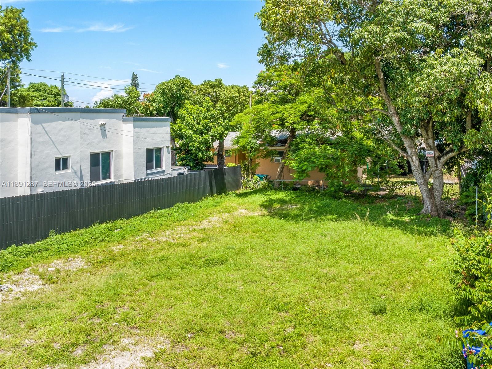 1881 Northwest 4th Street Miami, FL 33125 - Photo 3 of 8 a view of backyard with a garden and plants