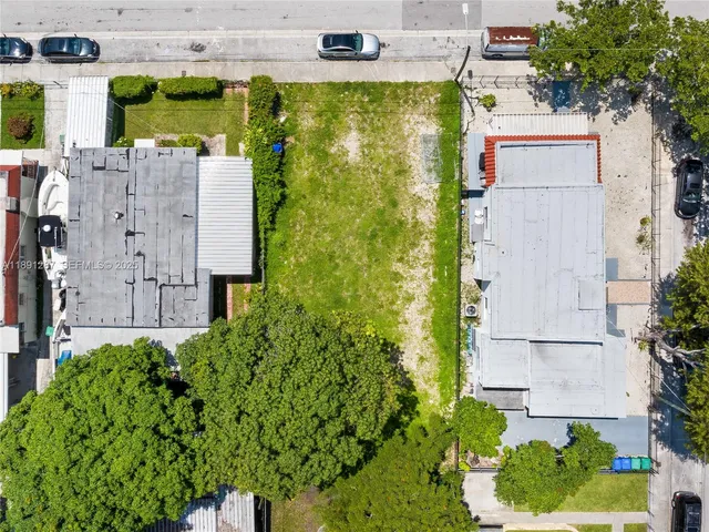 aerial view of multiple house with a garden