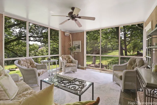 a large kitchen with kitchen island a large counter top space a sink stainless steel appliances and cabinets