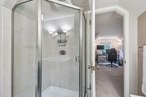 a room with pool table and windows