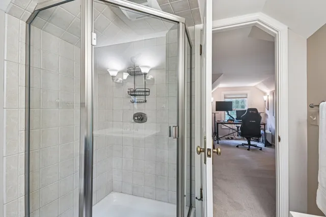 a room with pool table and windows