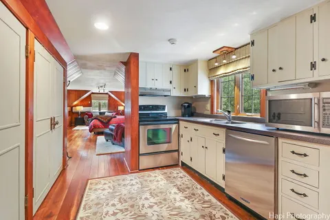 a view of a chairs and tables in the backyard of the house