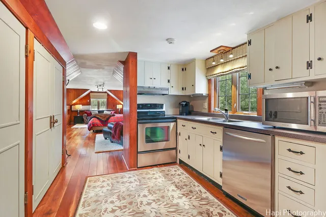 a view of a chairs and tables in the backyard of the house