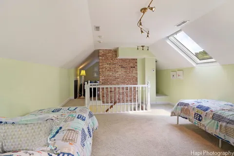 a front view of a building with a garden