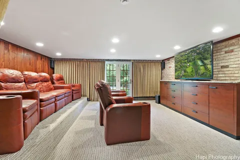 a front view of a house with a garden and yard