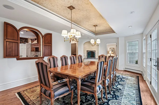 a living room with furniture a flat screen tv and a window