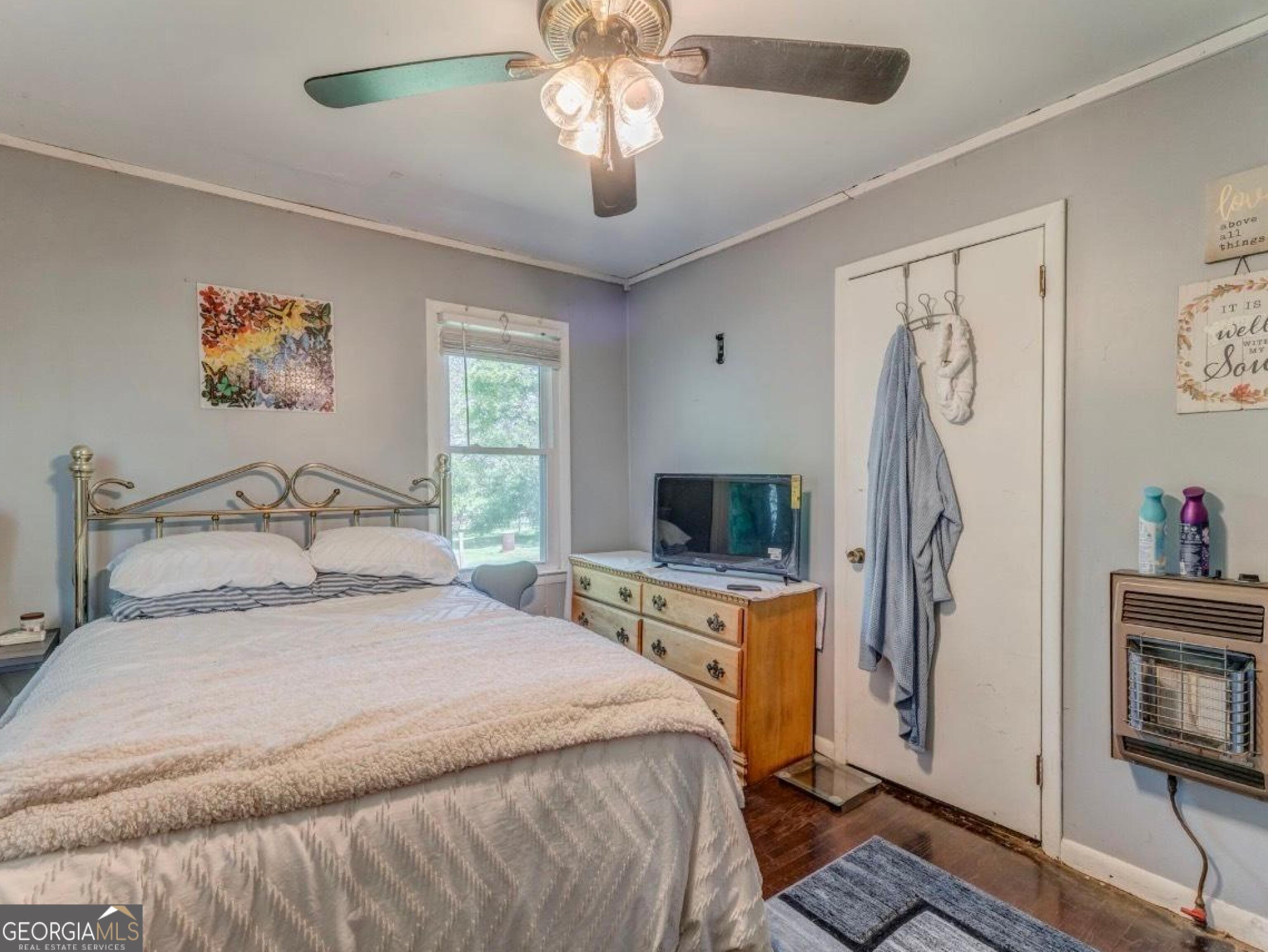 455 Bell Street Menlo, GA 30731 - Photo 11 of 18 a bedroom with a bed and a flat tv screen on the dresser